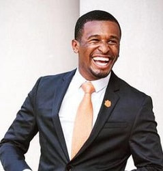 photo of man in suit, large smile